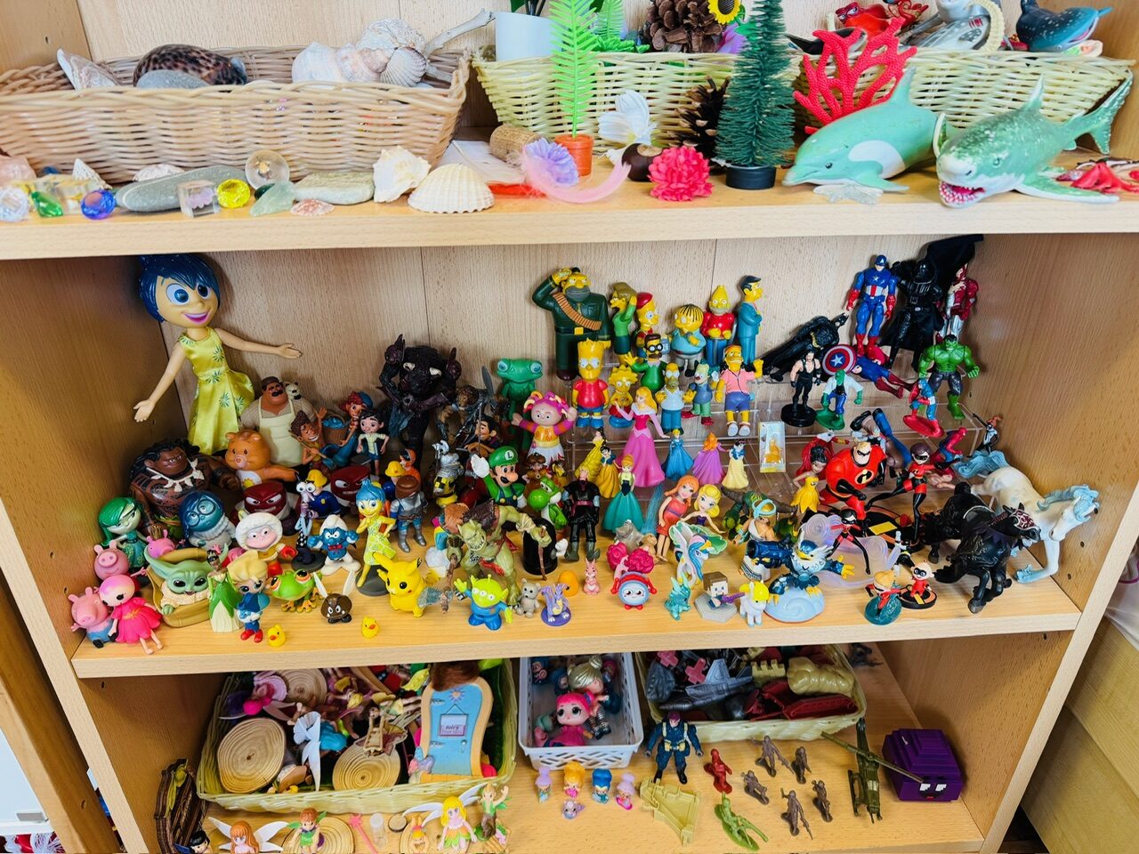 Shelves of small character figures and animals for storytelling